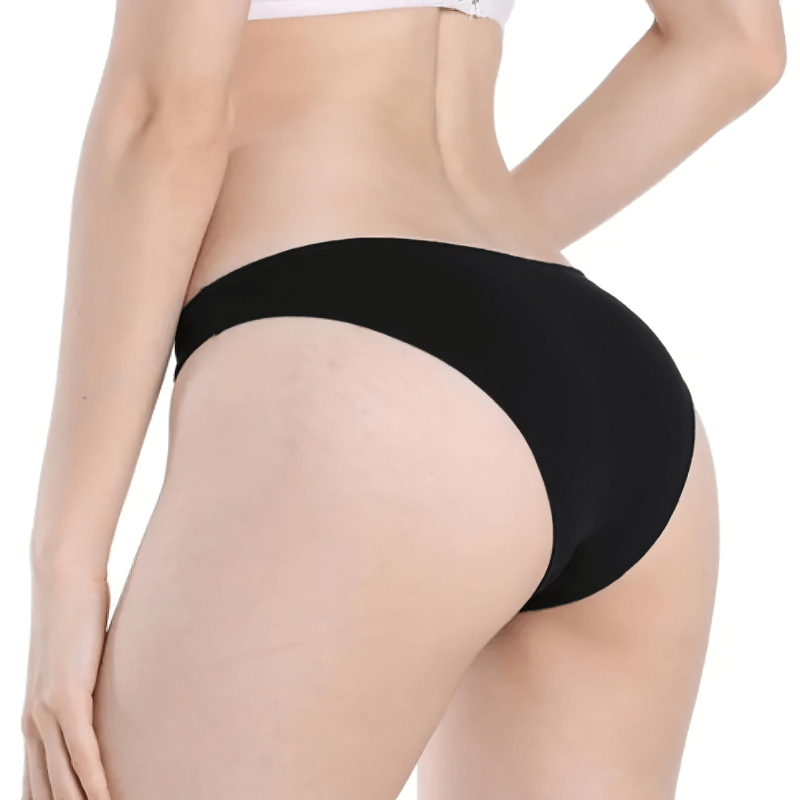 Back view of breathable women's sleek cotton low-rise briefs in black; stylish, elastic, minimalist design for everyday comfort.